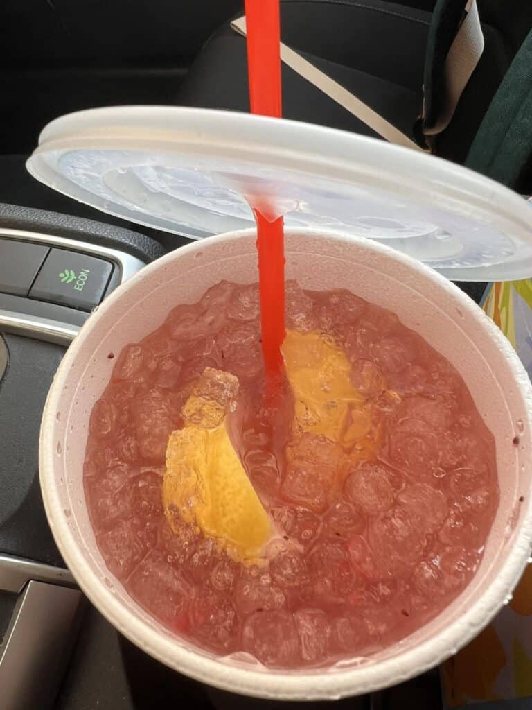 Large water with extra SF peach syrup, lemon, and strawberries