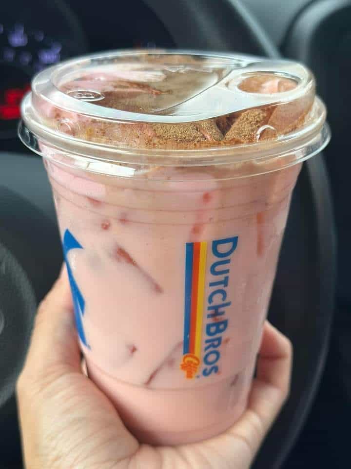 Strawberry horchata chai with strawberry soft top and cinnamon sprinkle